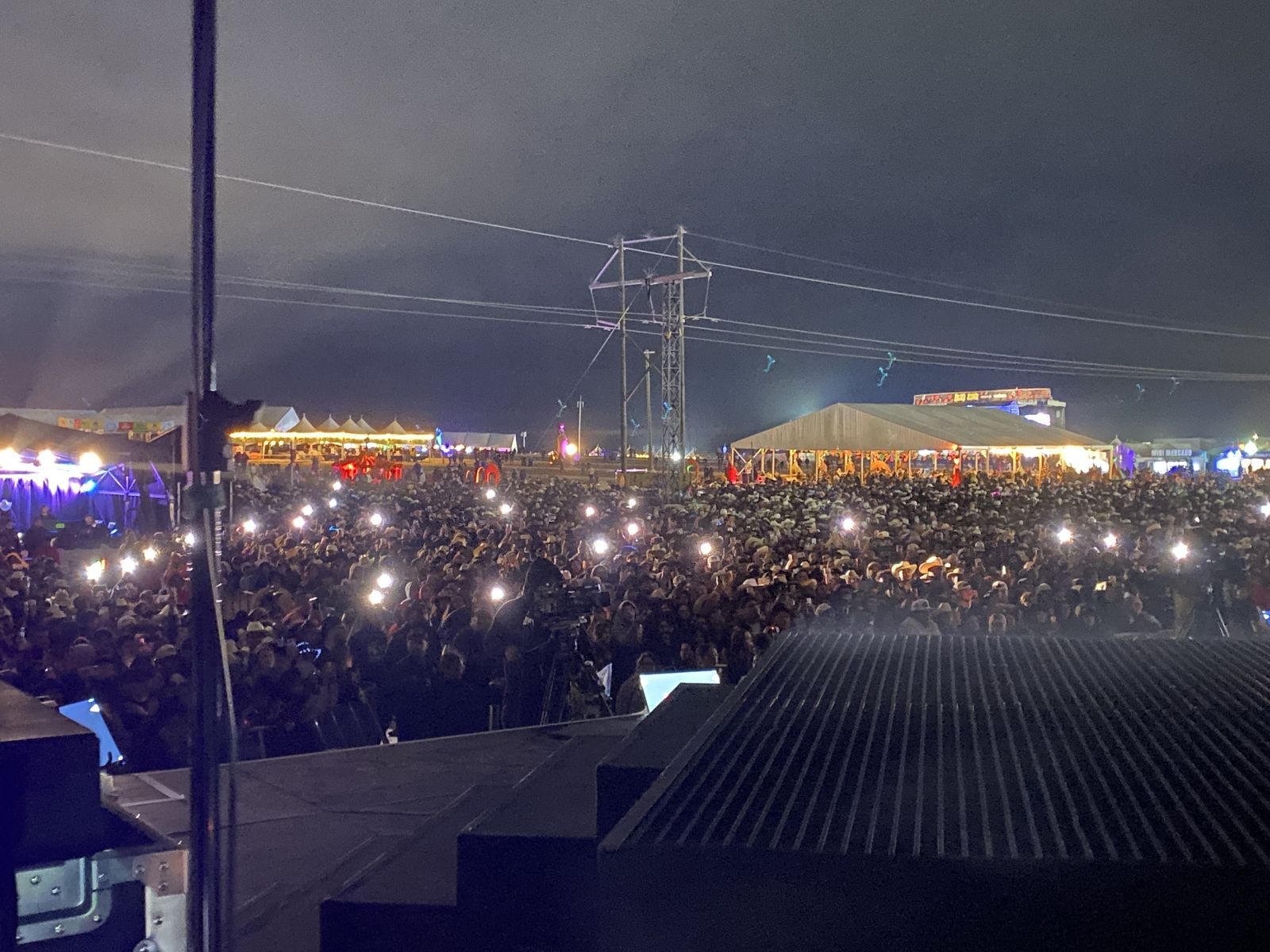 Festival crowd at night, seen from the stage